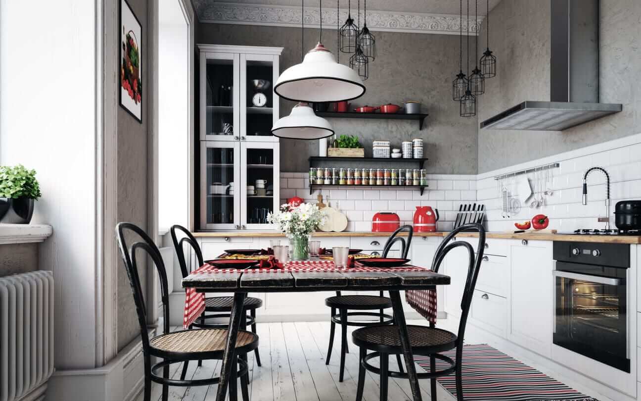 Industrial-inspired kitchen with white cabinetry, open shelving, statement pendant lights and a dining table
