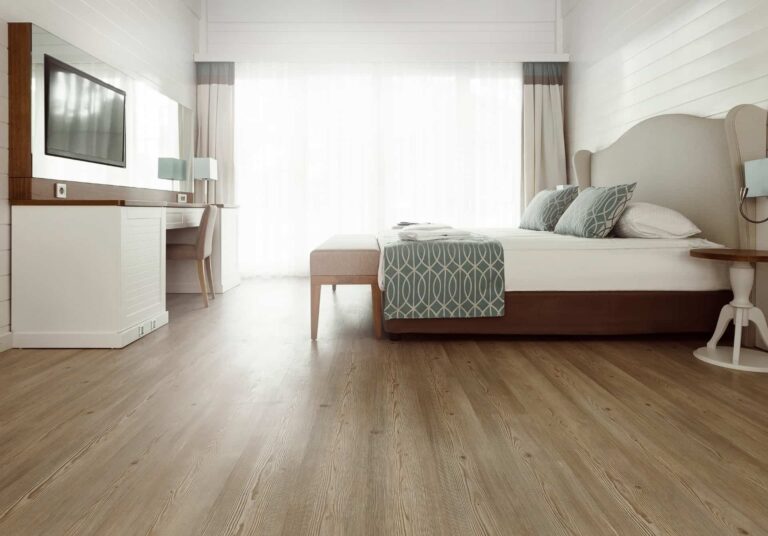 Bedroom interior with timber-look flooring.