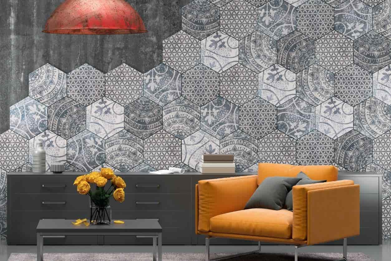 Feature wall created using patterned floor tiles in a modern living space.