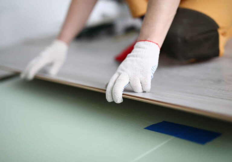 Close up of a floating floor being installed