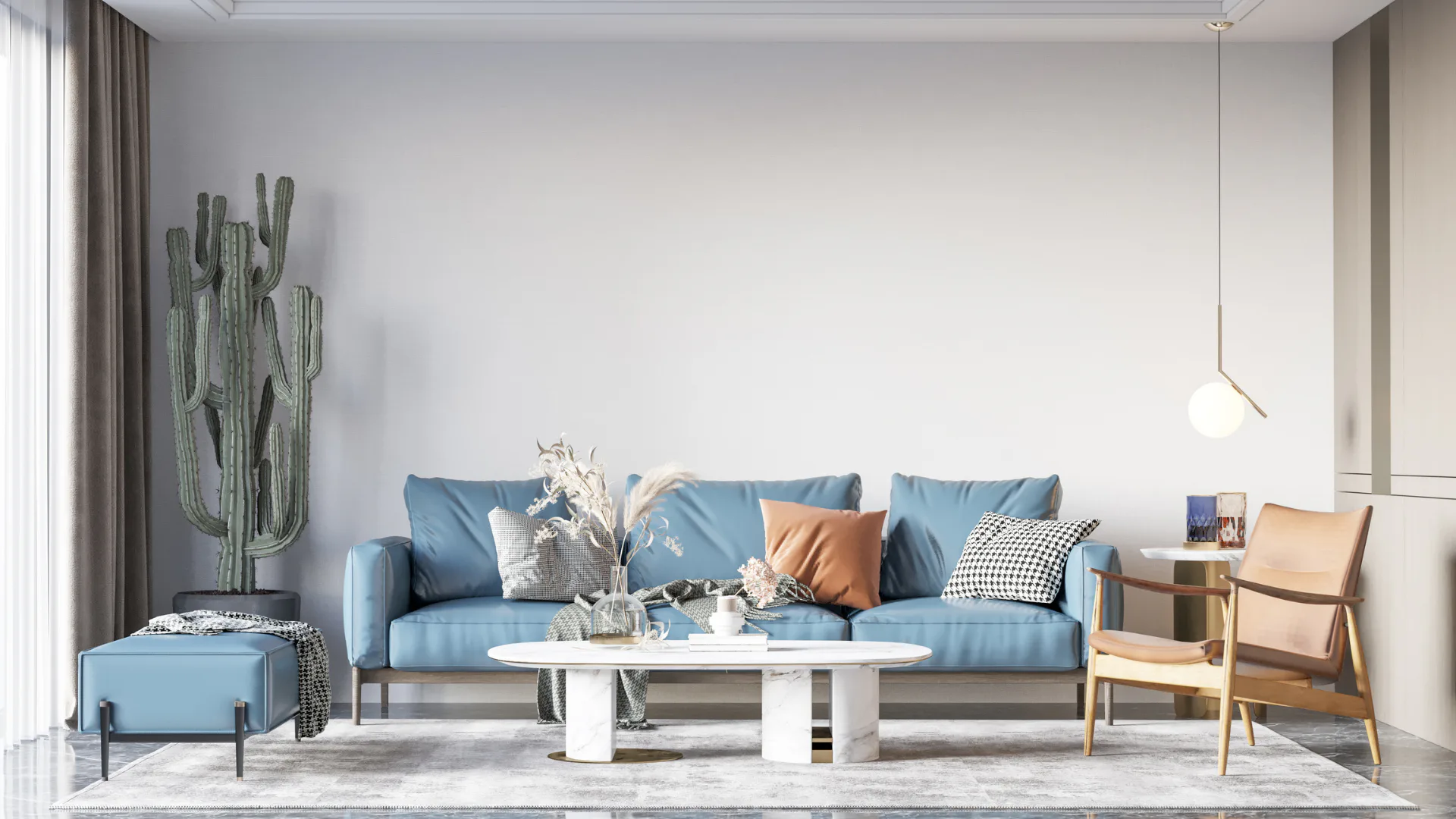 Modern living room featuring a light blue sectional sofa with patterned pillows, white marble oval coffee table, wooden accent chair, tall saguaro cactus plant, and pendant lighting in a minimalist...