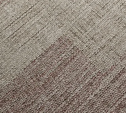 Close-up view of a commercial-grade carpet texture in neutral beige-gray tone, showing woven pile construction with tight, uniform texture suitable for commercial spaces.