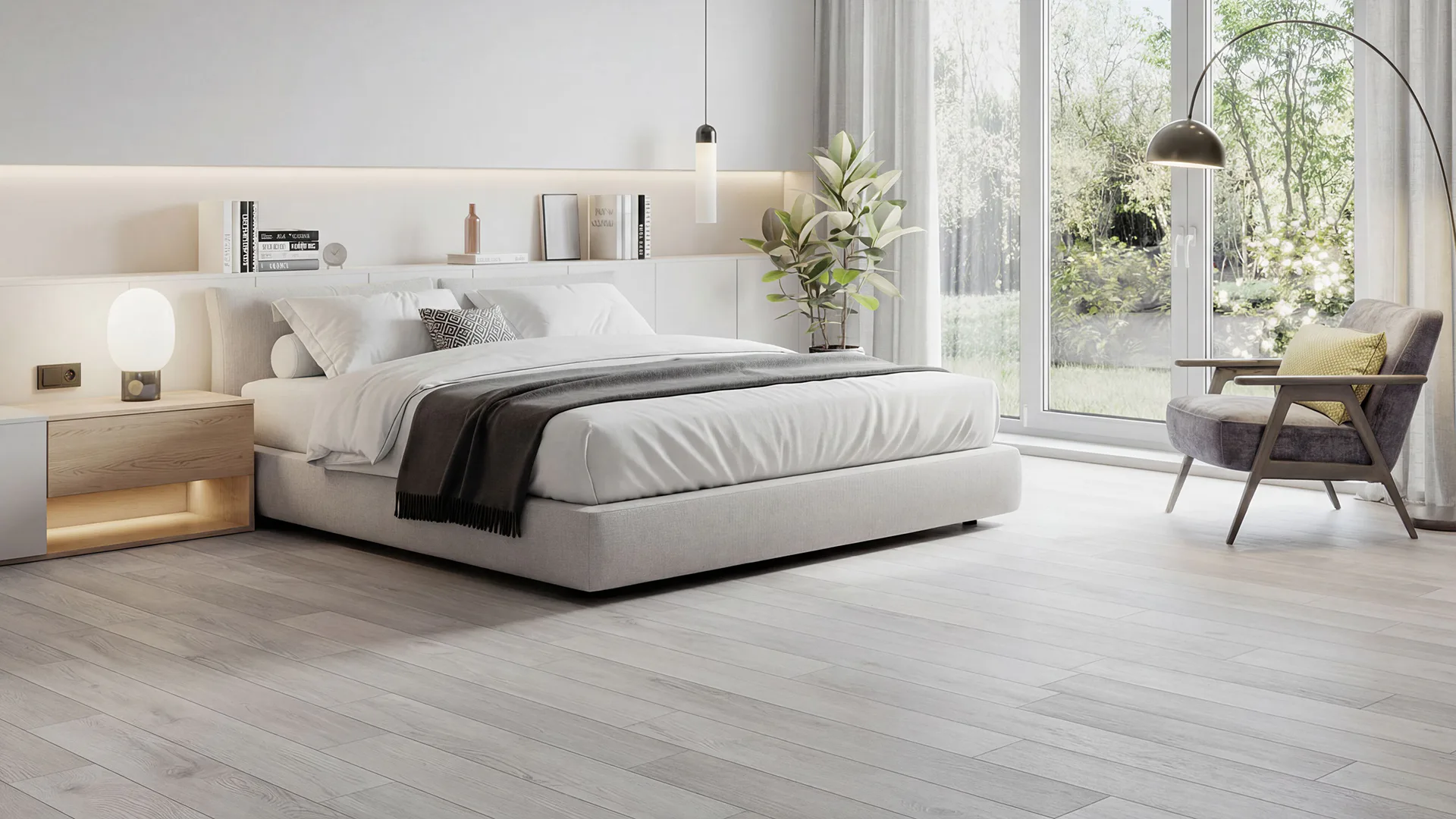 Bright modern bedroom featuring light gray luxury vinyl plank flooring, white platform bed with built-in shelving, charcoal accent chair, and large windows overlooking greenery