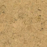 Close-up view of natural cork material showing a uniform tan and beige surface with dark speckles and organic grain patterns characteristic of authentic cork flooring or wall covering.